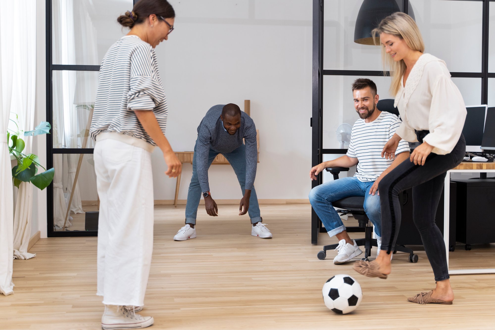 young-pleople-playing-with-ball-office young-pleople-playing-with-ball-office